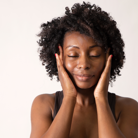 Woman with hands on her face