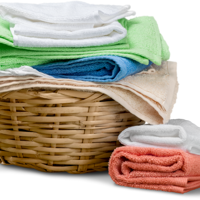 Wicker Laundry basket stacked with towels 