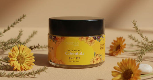 A jar of Baobab Swirls Calendula Salve for babies, handcrafted in Zambia with local Mongongo oil and botanical ingredients.