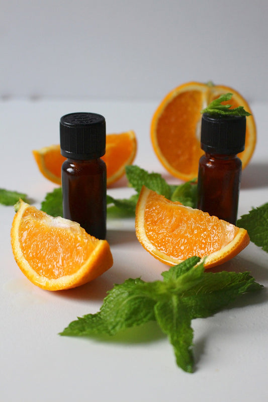 Orange wedges and essential oil bottles 