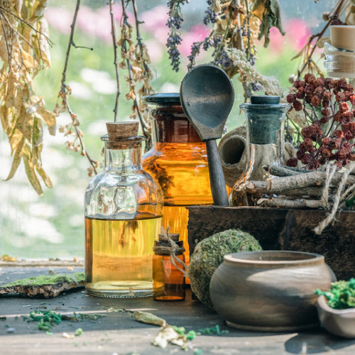 Oils and herbs in glass bottles 