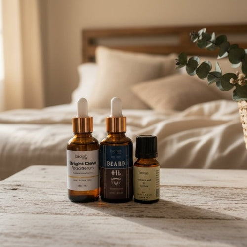 Skincare products on a table with a bed in the background