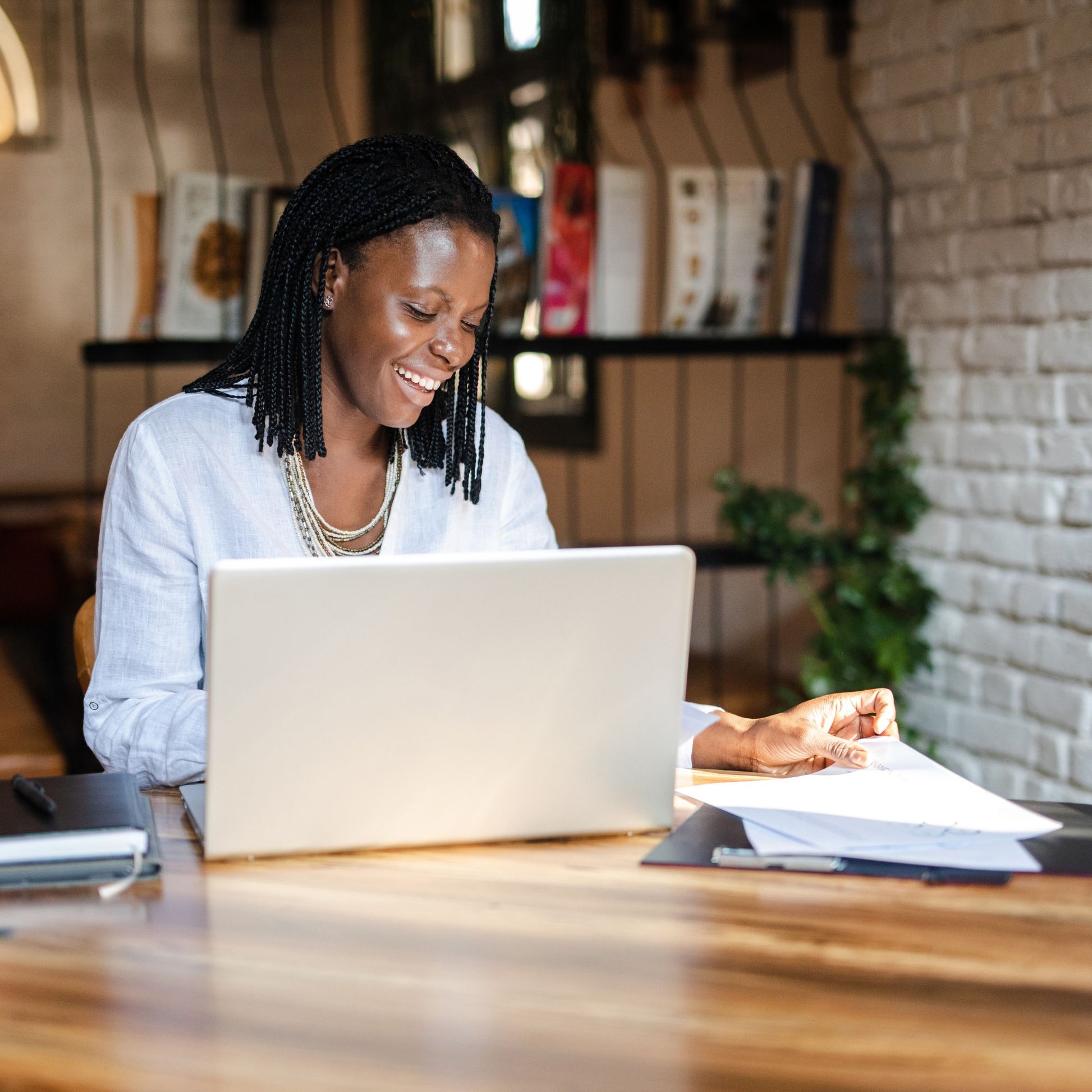 Smiling woman working on her laptop 
