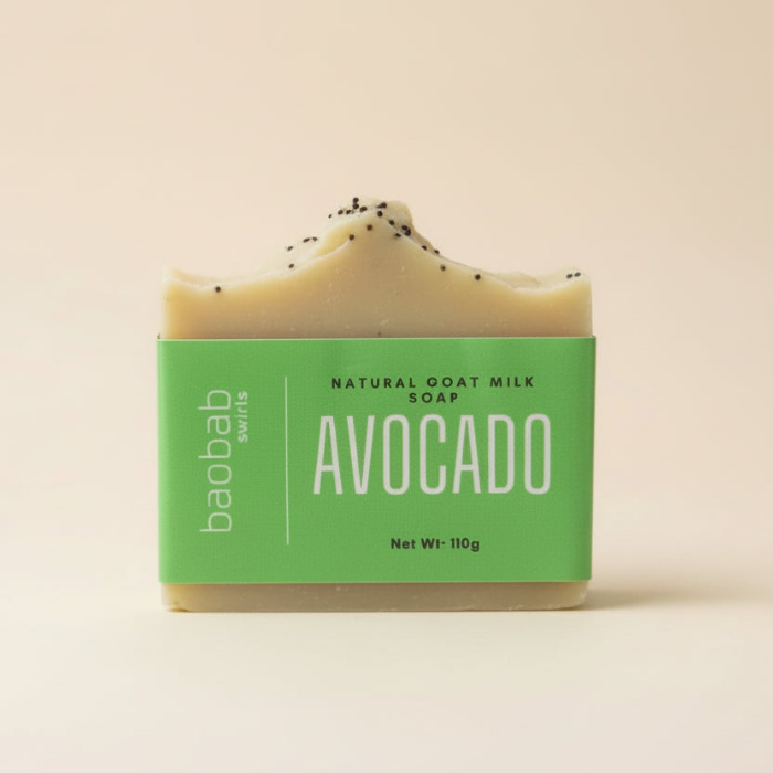 Avocado soap bar with a Baobab Swirls green label on a beige background