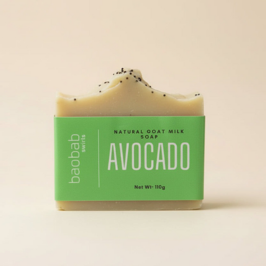 Avocado soap bar with a Baobab Swirls green label on a beige background