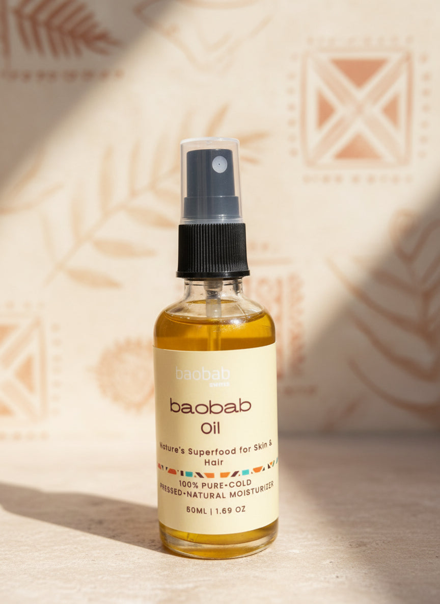 Bottle of baobab oil with a label on a textured surface