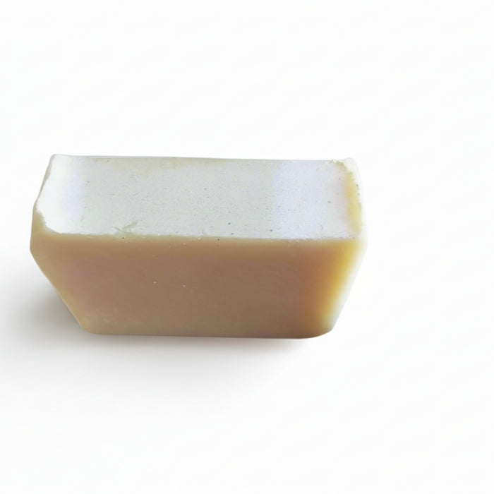 Rectangular bar of soap with a white top and brown bottom on a white background