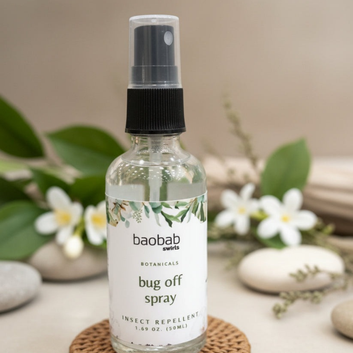Baobab Swirls Bugs Spray bottle with leaves and flowers in the background