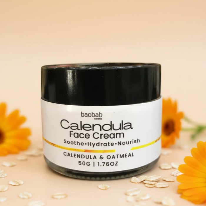 Jar of Calendula Face Cream with flowers and oats on a beige background