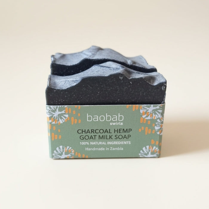 Two bars of charcoal soap in Baobab Swirls branding