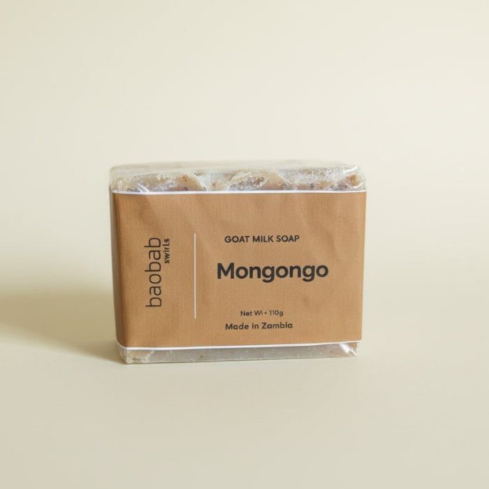 Goat milk soap bar with 'baobab swirls' branding on a beige background