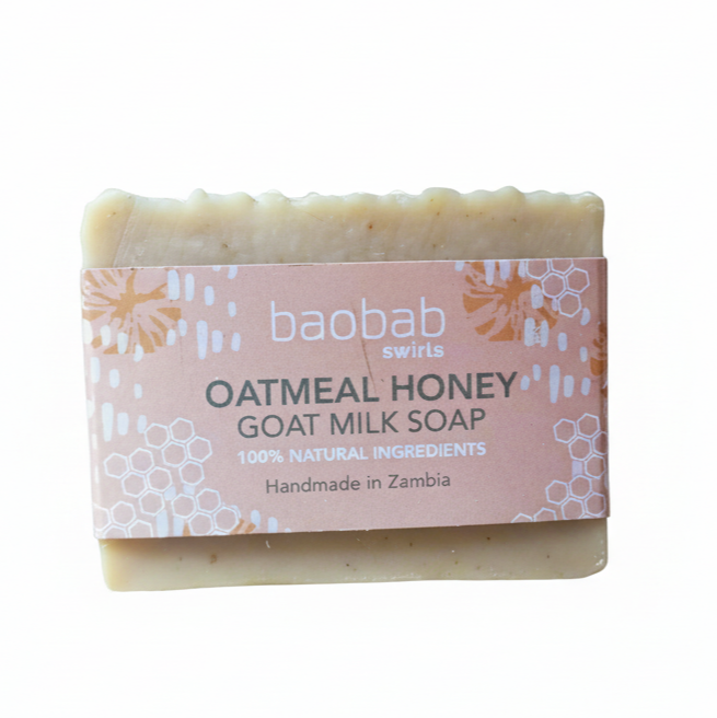 Oatmeal Honey Bar of soap with a pink label on a white background from Baobab Swirls