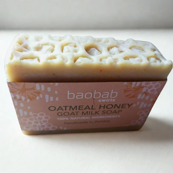 Bar of soap with 'baobab swirls' branding on a white background