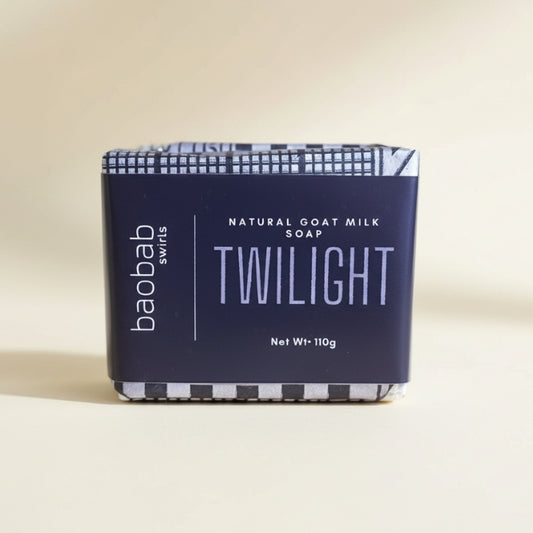 Bar of soap with 'baobab swirls' branding on a beige background