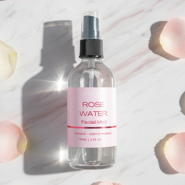 Baobab Swirls Rose water facial mist bottle with pink label on a light background